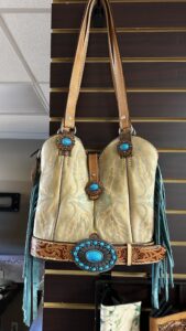 Tan leather handbag with turquoise, fringe, and western tooling by High Noon Leather, ideal for Las Cruces western style.