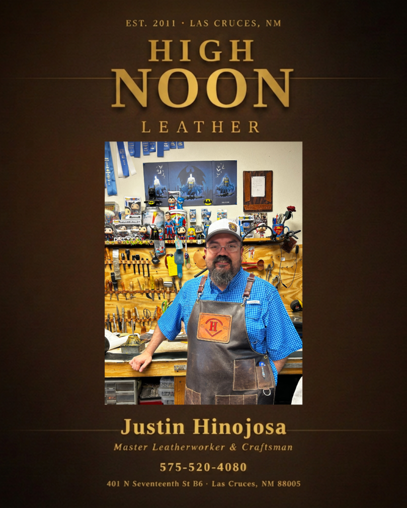 Bearded craftsman in apron at High Noon Leather workshop, Las Cruces, with leatherworking tools displayed behind him.