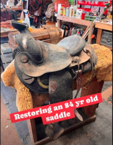 High Noon Leather saddle on workbench in Las Cruces workshop, showcasing Saddle Whisperer craftsmanship.